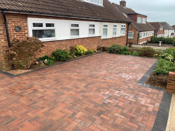 Fitting paving on a driveway in Blindley Heath, Surrey