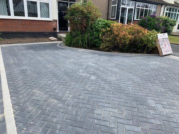 Fitting paving on a driveway in Chaldon, Surrey