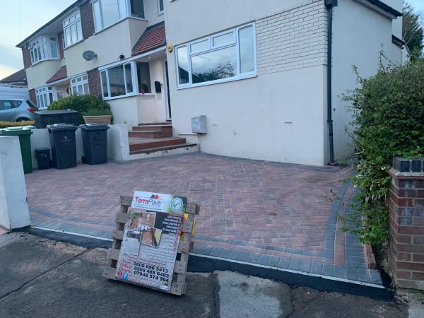 Fitting paving on a driveway in Hever, Kent