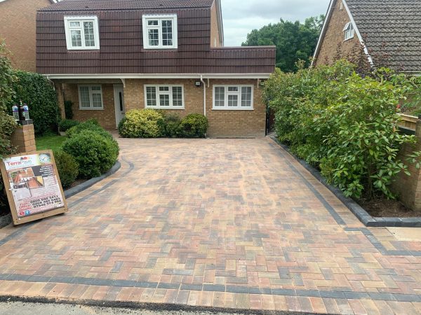 Fitting paving on a driveway in Old Coulsdon, London