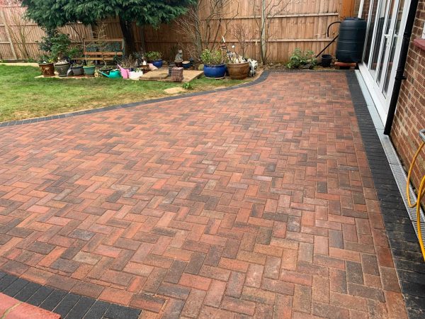 Fitting paving on a driveway in Oxted, Surrey