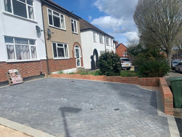 Fitting paving on a driveway in Shipley Bridge, Surrey