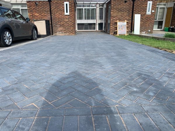 Fitting paving on a driveway in Shipley Bridge, Surrey