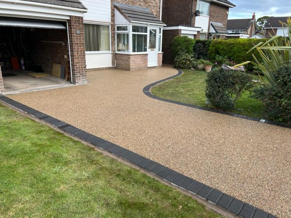 Laying resin surface on a driveway in Caterham, Surrey